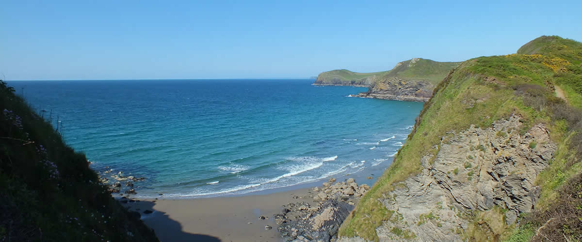 Hidden cove along the coast path along the north coast of Cornwall, close to Polzeath